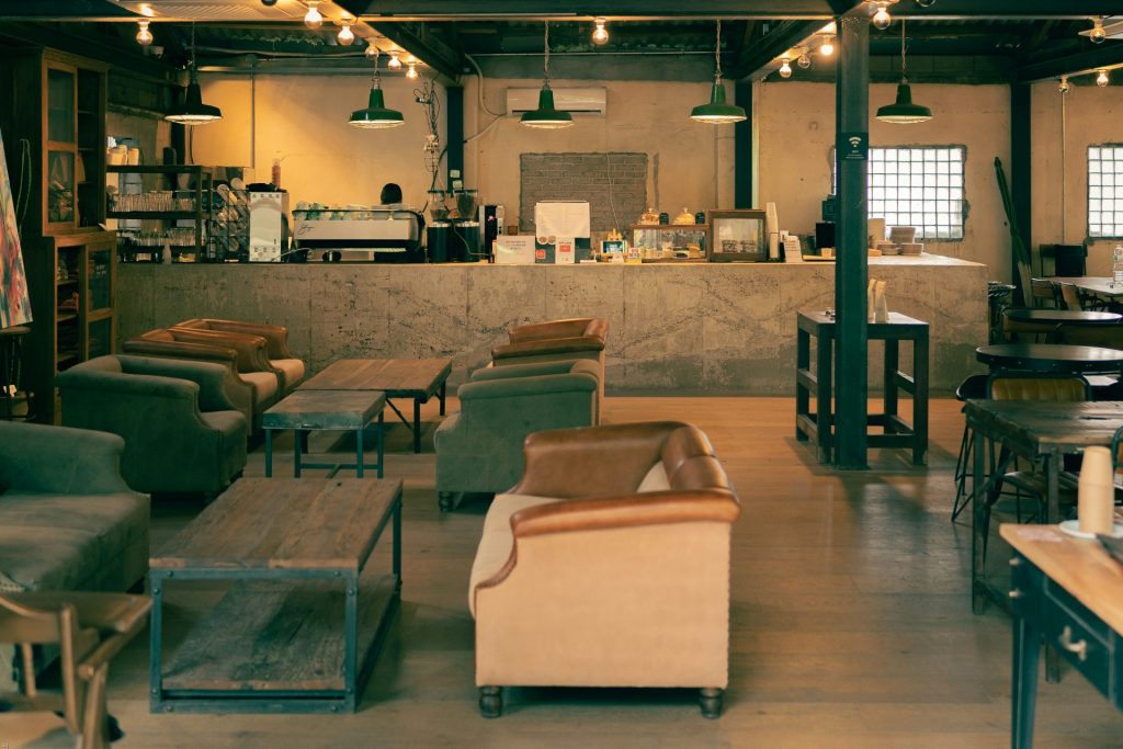 white leather sofa chair near glass table